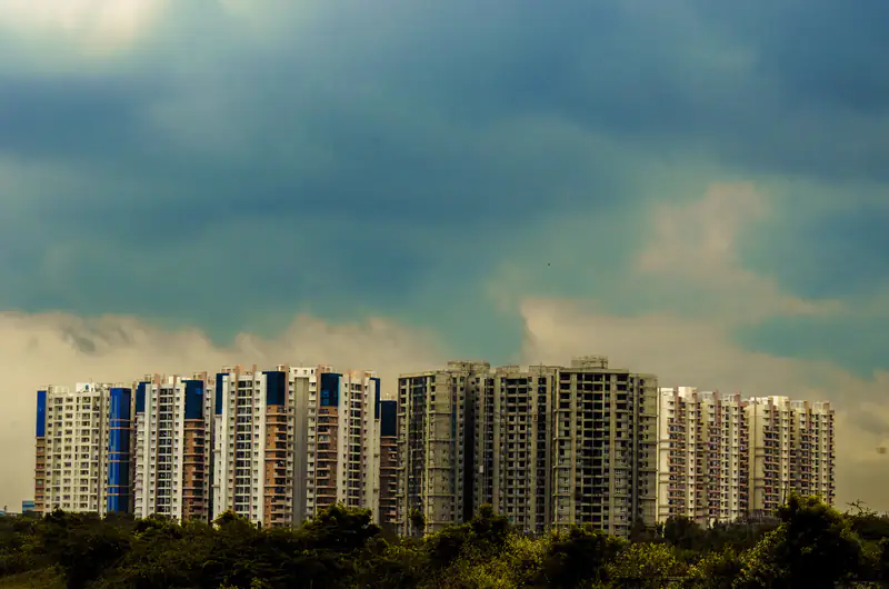 Residential apartment towers under a dramatic sky